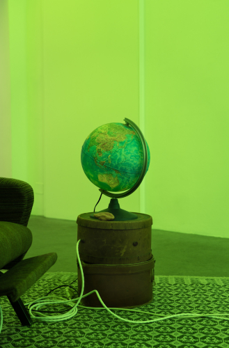 Roberto Casti, From the depths of the Earth (globe), 2026, globe, hat boxes, ceramic sculpture, cables, speakers, LED light, sound, 80 cm Ø 35 cm